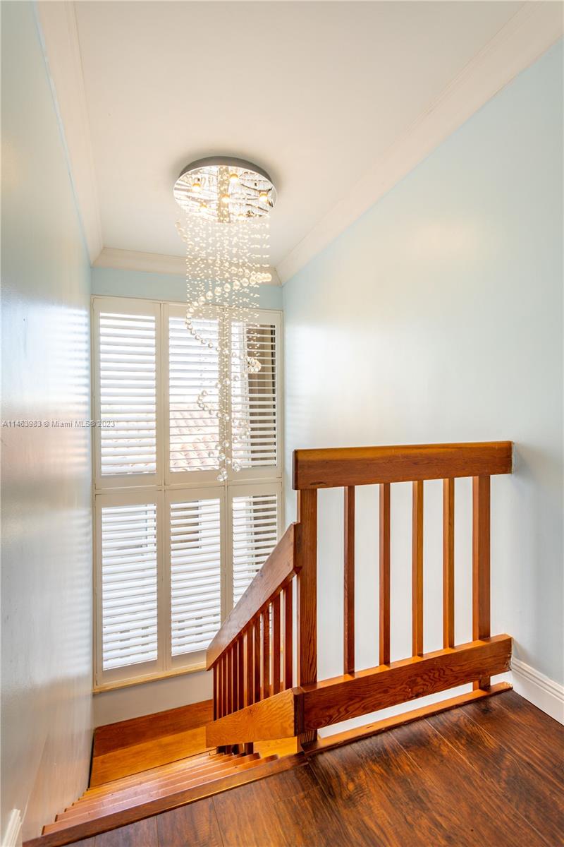 7700 Hawthorne Avenue Miami Beach, FL 33141 - Photo 34 of 36 a view of entryway with wooden floor