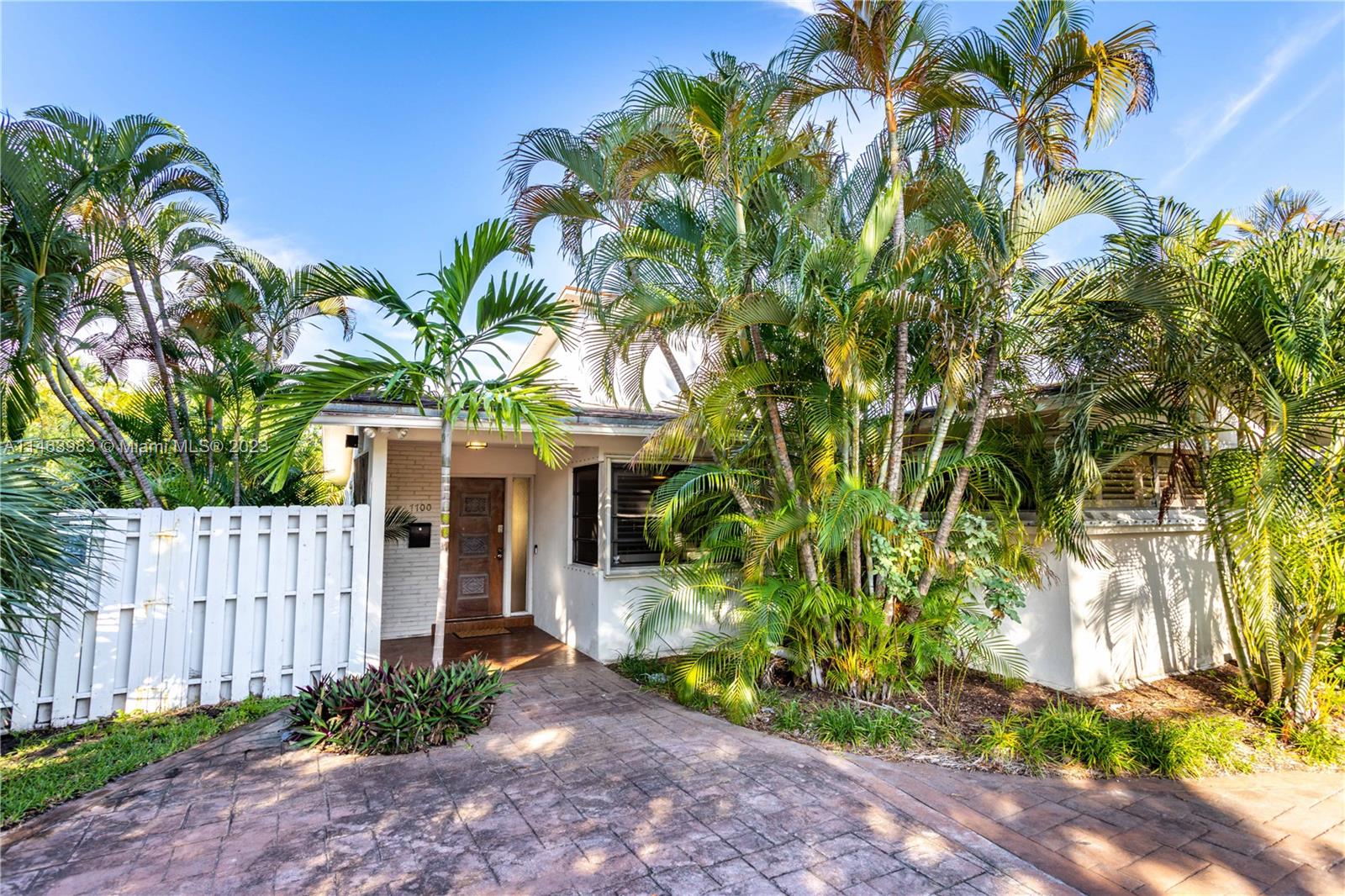 7700 Hawthorne Avenue Miami Beach, FL 33141 - Photo 10 of 36 a view of a garden with potted plants