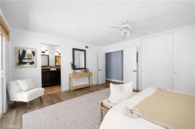 a bedroom with a bed couches and furniture