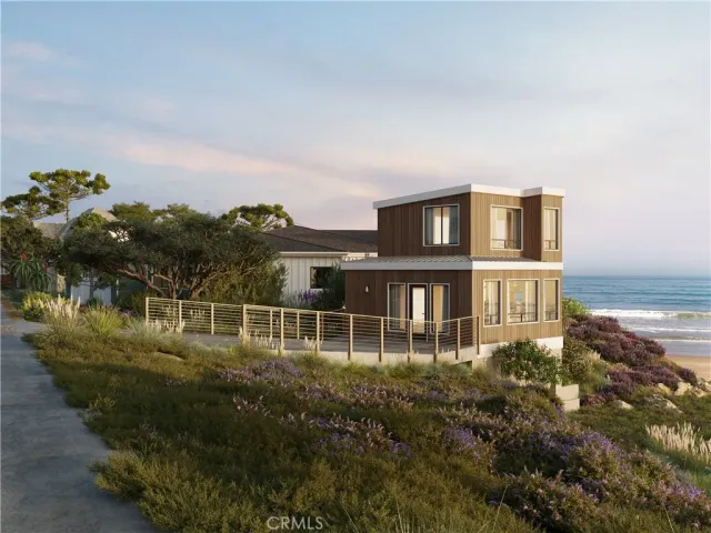 a view of a house with a yard and sitting area