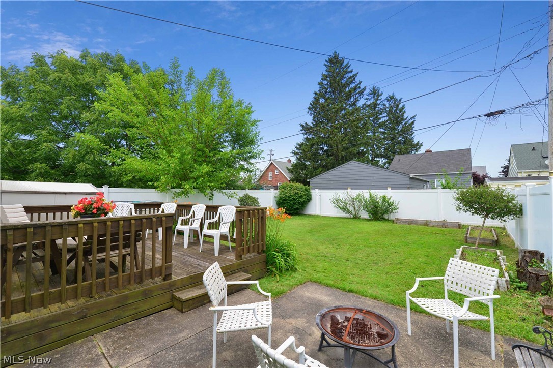 7914 Jameson Road Parma, OH 44129 - Photo 7 of 35 Large Backyard deck & concrete patio - perfect for a fire pit!