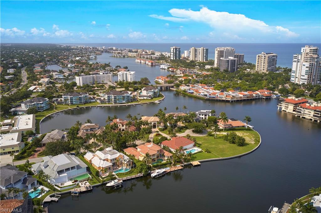 303 Turtle Hatch Road Naples, FL 34103 - Photo 2 of 2 an aerial view of a city with lake view
