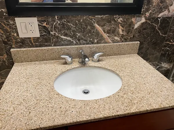 a bathroom with a sink and mirror