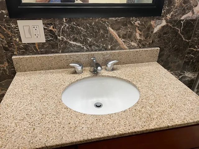 a bathroom with a sink and mirror