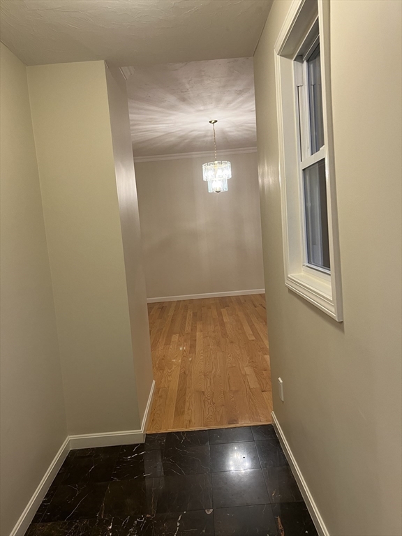 194 Auburn Street, Unit 2 Newton, MA 02466 - Photo 10 of 19 an empty room with wooden floor and windows