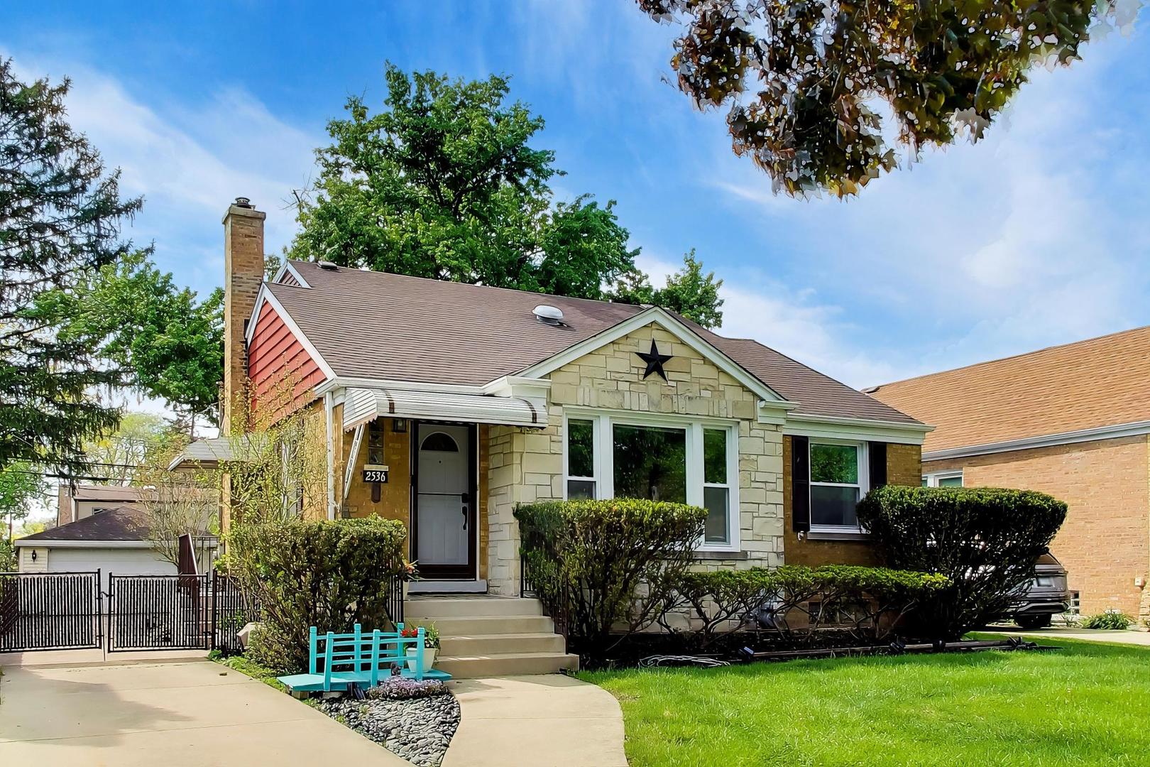 2536 5th Avenue North Riverside, IL 60546 - Photo 2 of 24 a front view of a house with a garden