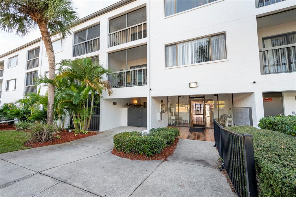 a front view of a building with a yard