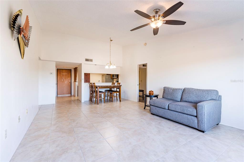 2593 Countryside Boulevard, Unit 7307 Clearwater, FL 33761 - Photo 12 of 32 a living room with furniture and kitchen view