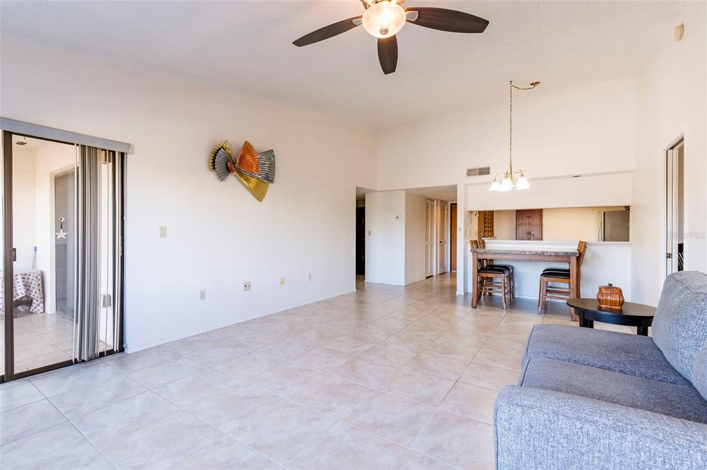 2593 Countryside Boulevard, Unit 7307 Clearwater, FL 33761 - Photo 13 of 32 a living room with furniture and ceiling fan