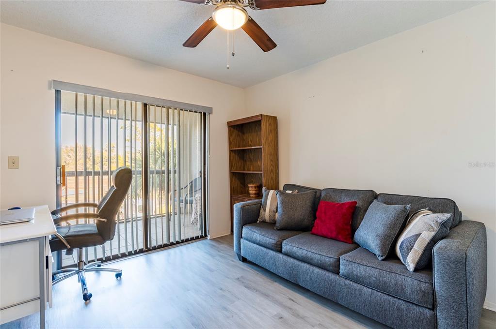 2593 Countryside Boulevard, Unit 7307 Clearwater, FL 33761 - Photo 18 of 32 a living room with furniture and a large window