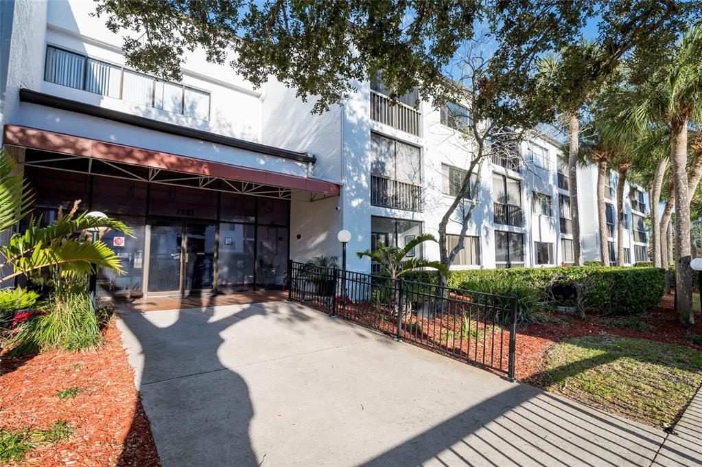 2593 Countryside Boulevard, Unit 7307 Clearwater, FL 33761 - Photo 26 of 32 a view of a building with sitting area