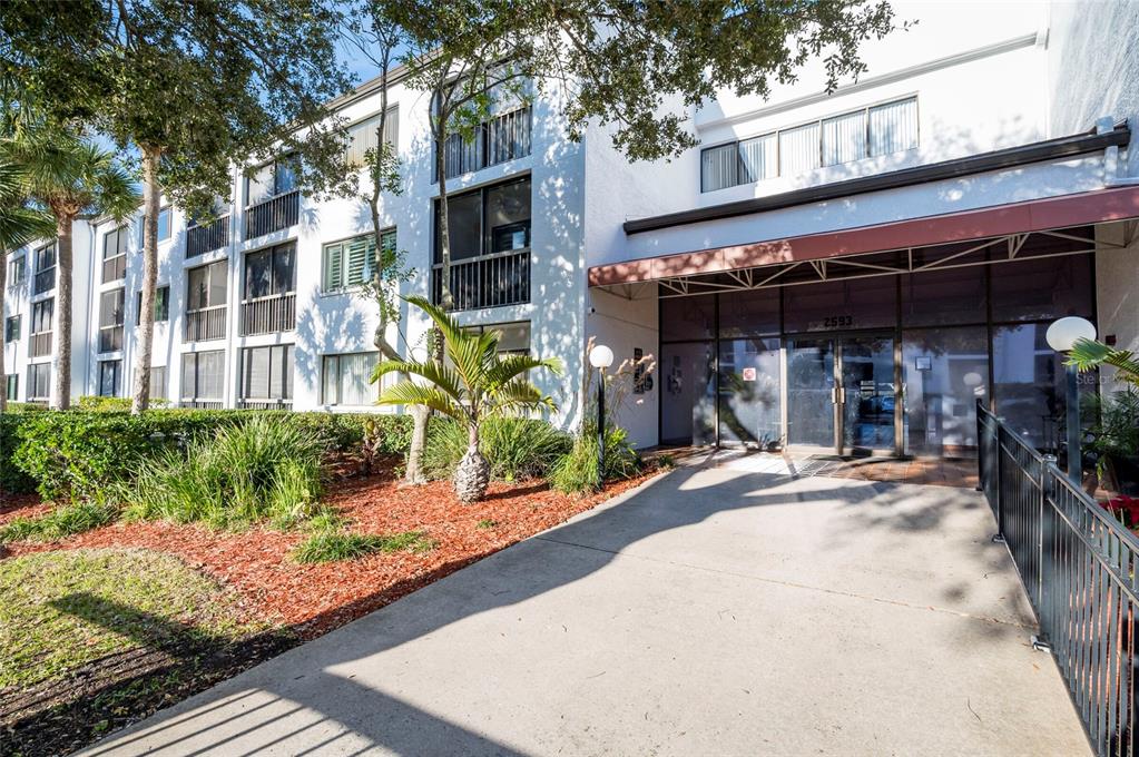 2593 Countryside Boulevard, Unit 7307 Clearwater, FL 33761 - Photo 27 of 32 a view of a building with sitting area
