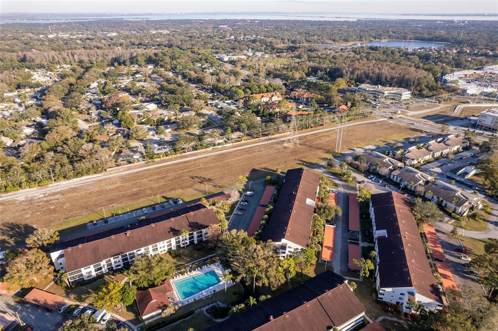2593 Countryside Boulevard, Unit 7307 Clearwater, FL 33761 - Photo 29 of 32 an aerial view of residential houses with outdoor space