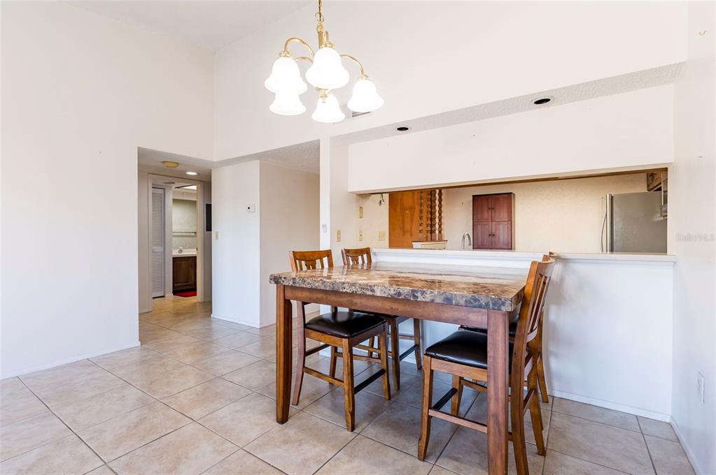 2593 Countryside Boulevard, Unit 7307 Clearwater, FL 33761 - Photo 5 of 32 a dining room with a table and chairs