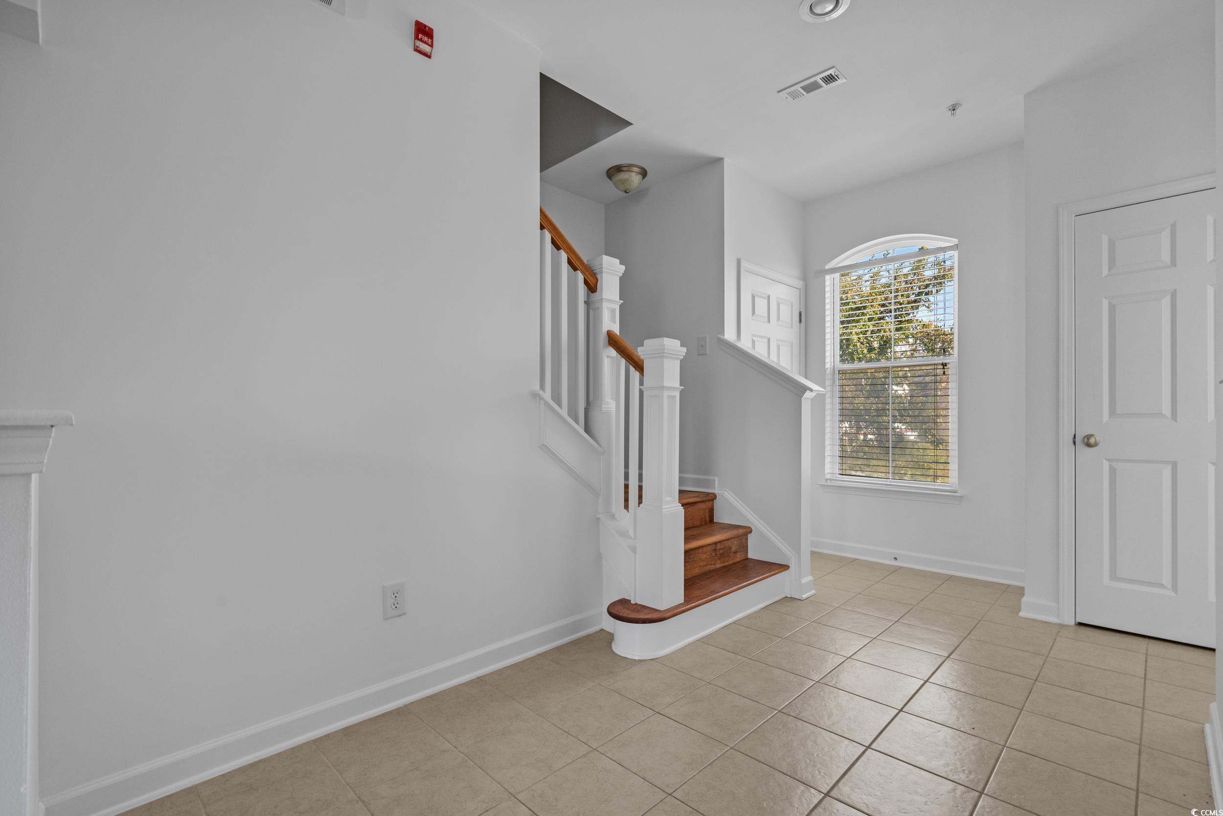 2798 Howard Avenue, Unit B Myrtle Beach, SC 29577 - Photo 16 of 40 Foyer with stairs and light tile patterned floors