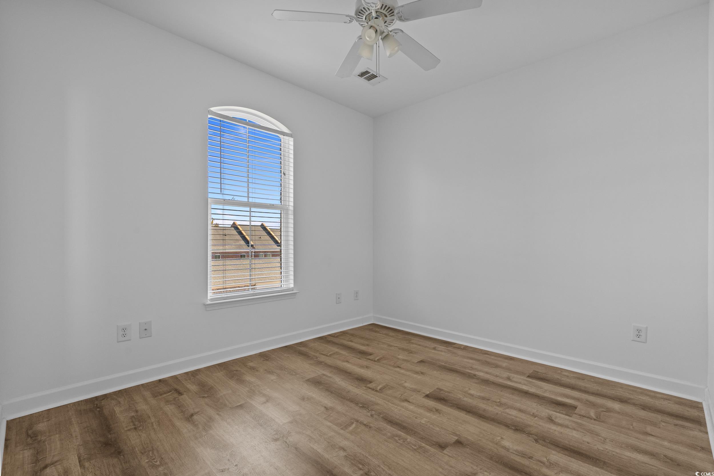 2798 Howard Avenue, Unit B Myrtle Beach, SC 29577 - Photo 18 of 40 Spare room featuring wood finished floors and a ceiling fan