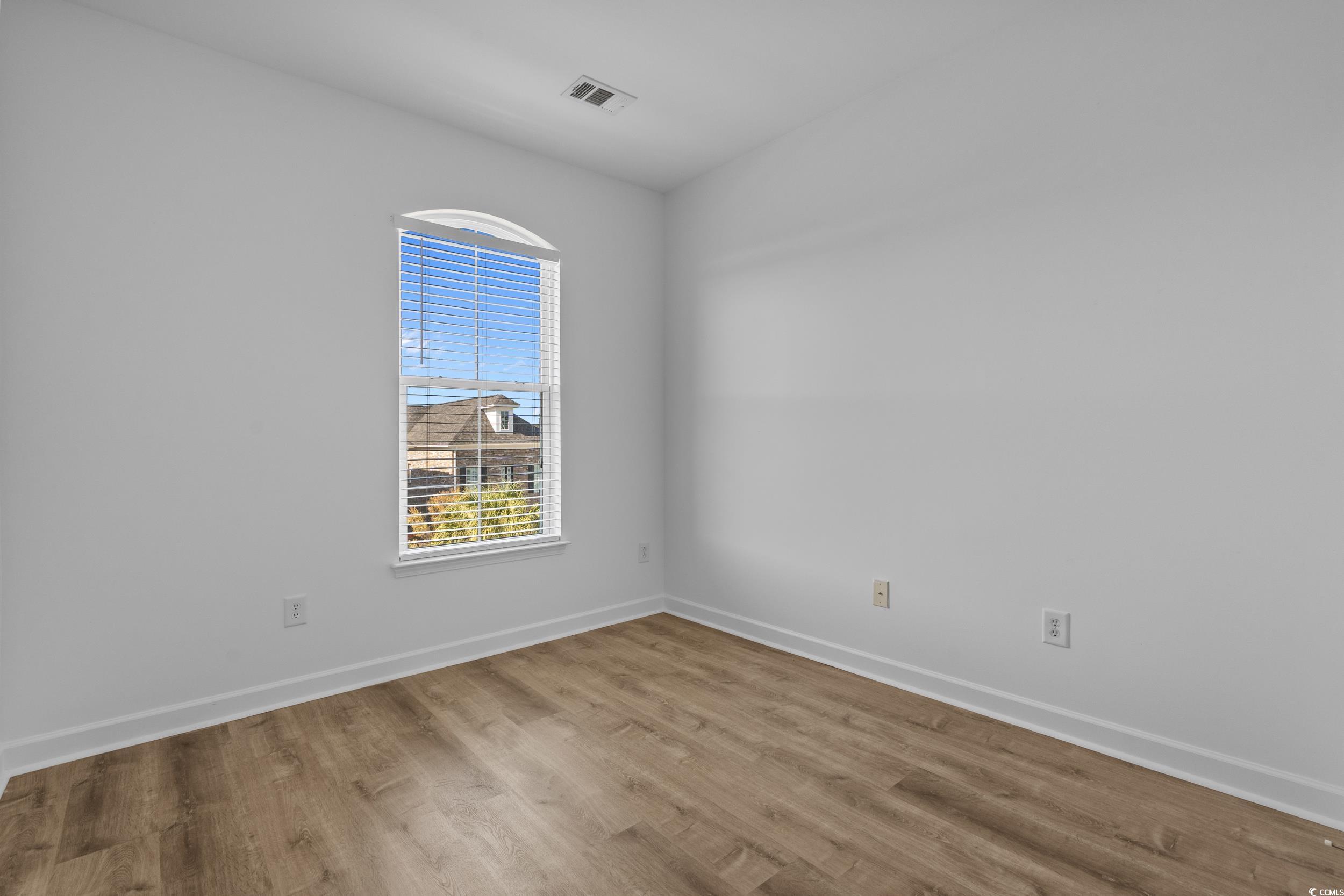 2798 Howard Avenue, Unit B Myrtle Beach, SC 29577 - Photo 22 of 40 Empty room with baseboards and wood finished floors