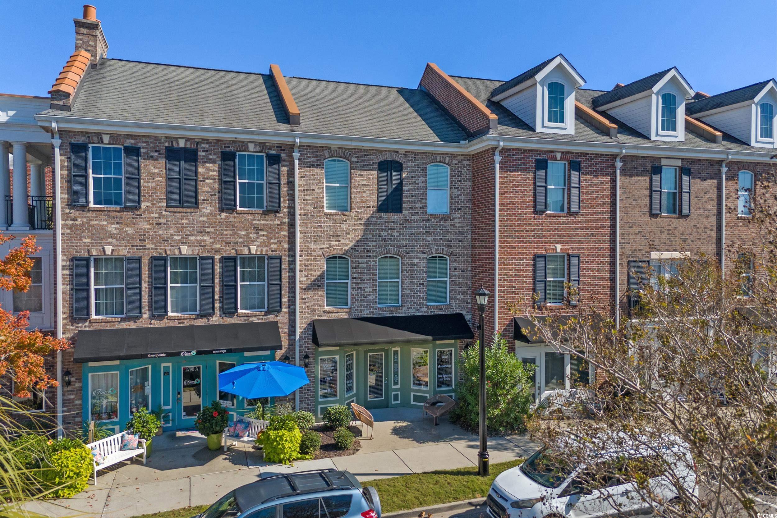 2798 Howard Avenue, Unit B Myrtle Beach, SC 29577 - Photo 29 of 40 View of front of home featuring brick siding, a chimney, and a shingled roof