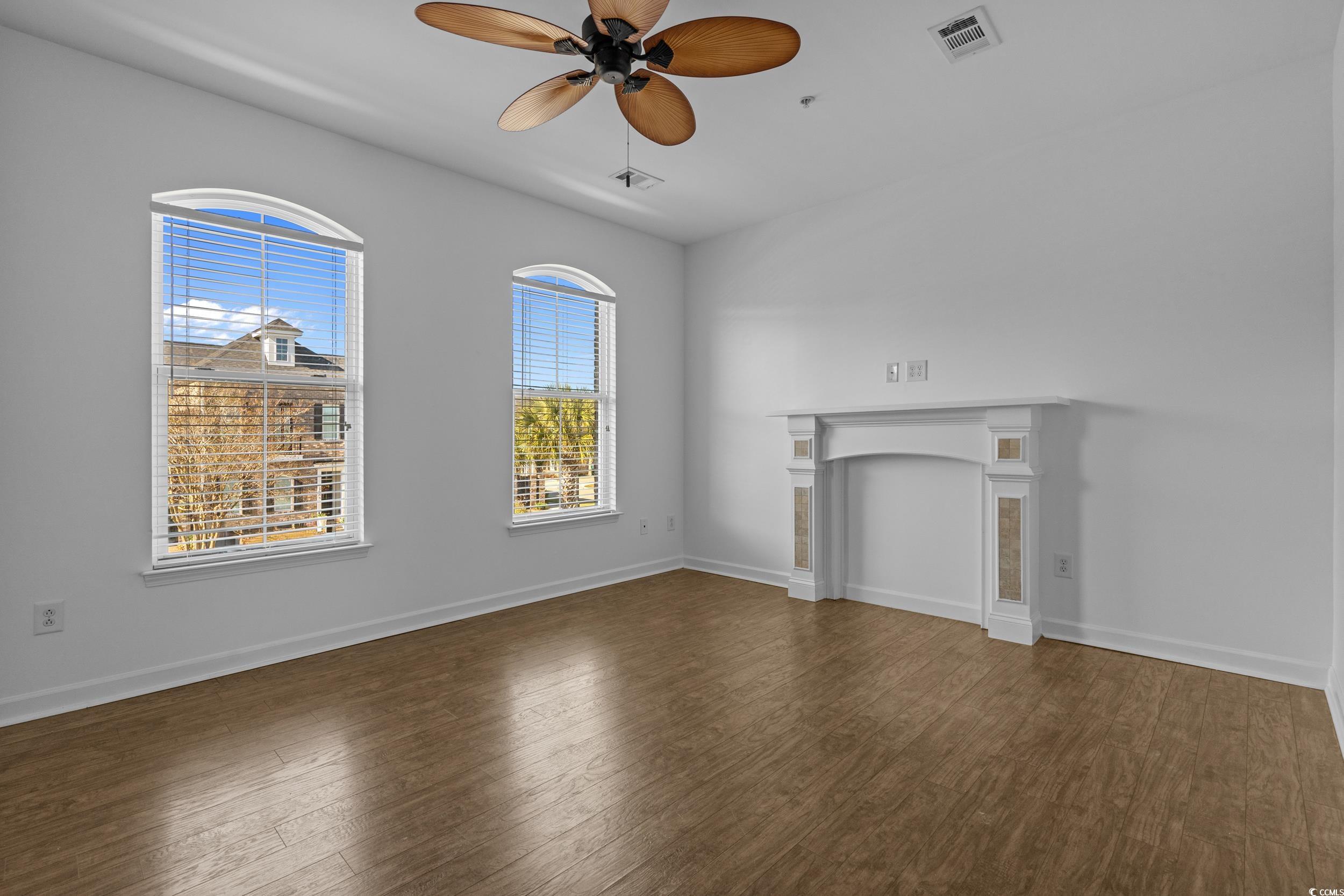 2798 Howard Avenue, Unit B Myrtle Beach, SC 29577 - Photo 5 of 40 Unfurnished living room with dark wood-style floors and a ceiling fan