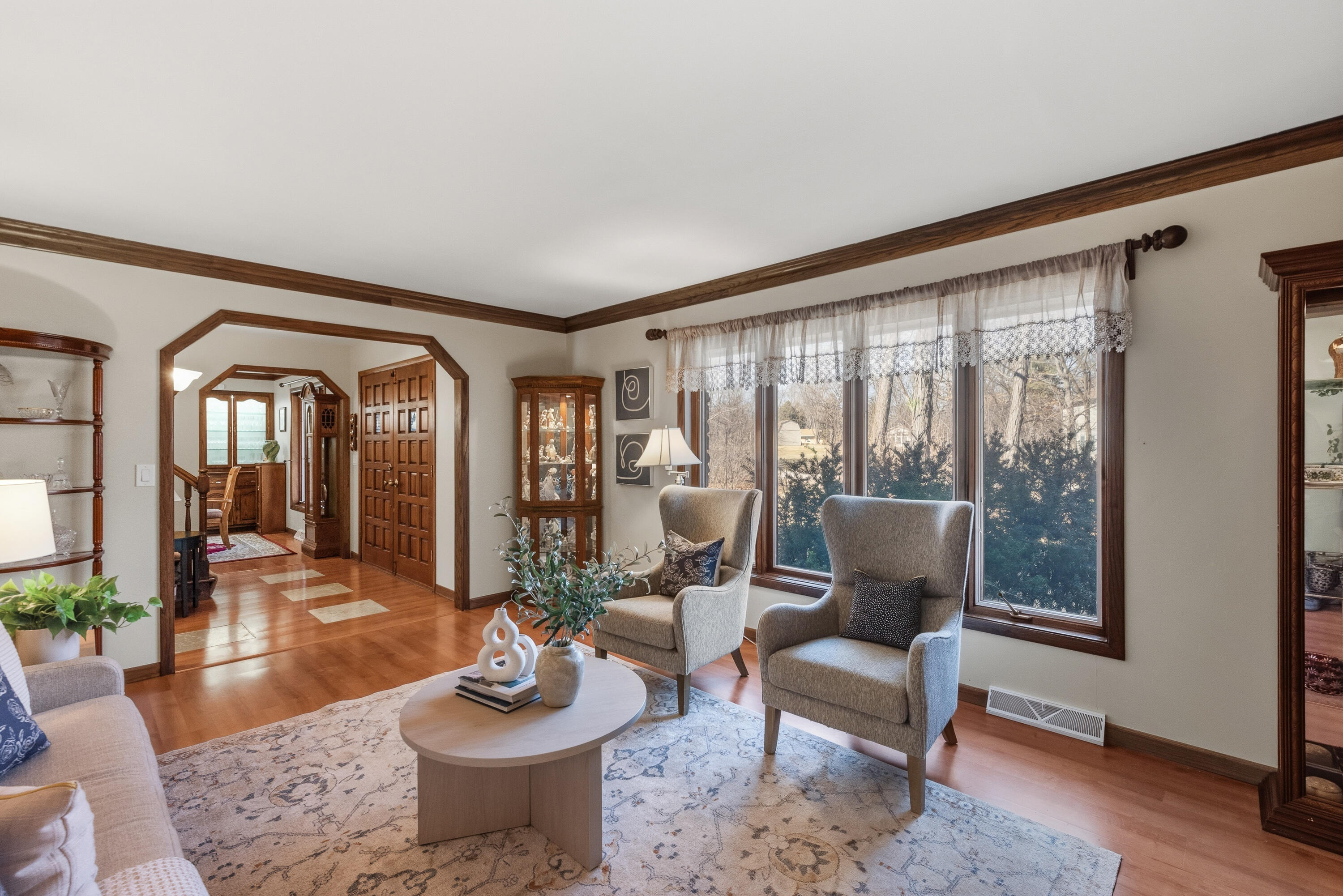 12785 West Bobwood Road New Berlin, WI 53151 - Photo 15 of 39 Living Room, Large Windows, View to Yard and Foyer/DR