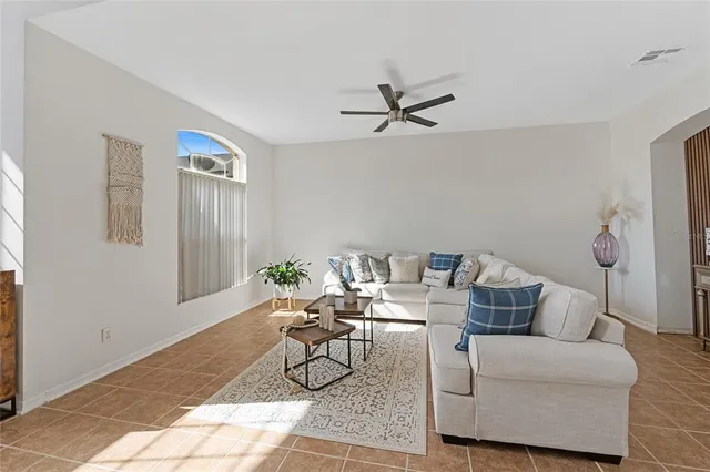 a living room with furniture and a window