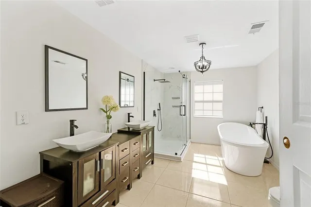 a bathroom with a toilet a sink and shower