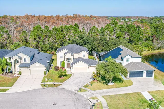 an aerial view of residential houses with outdoor space