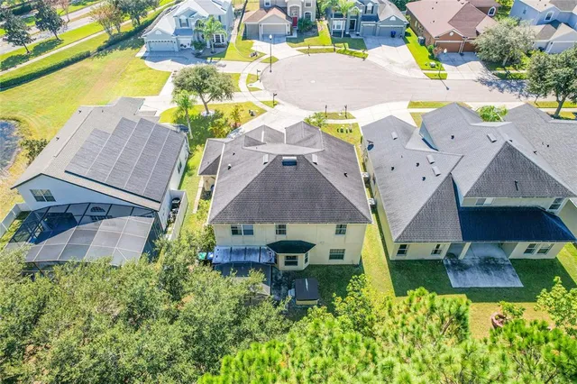 an aerial view of a house with a lake view