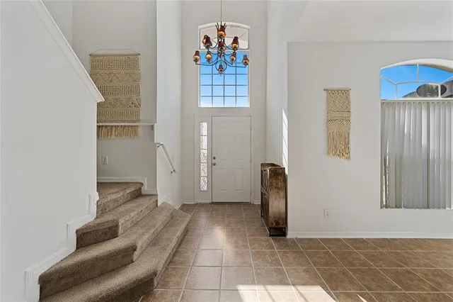 a view of a hallway with windows and stairs