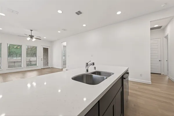 a kitchen with sink and microwave