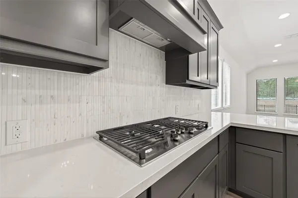 a kitchen with a stove and a sink