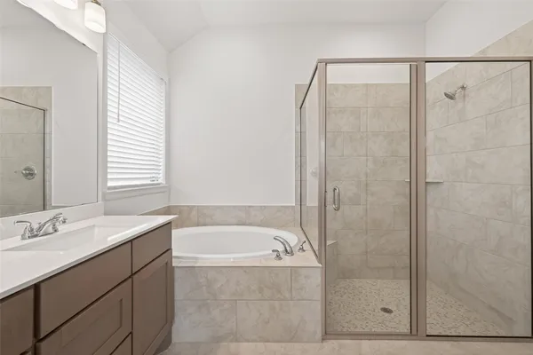 a bathroom with a bathtub and a sink