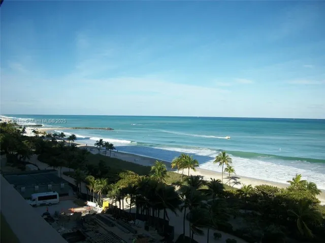 a view of building with yard and staircase