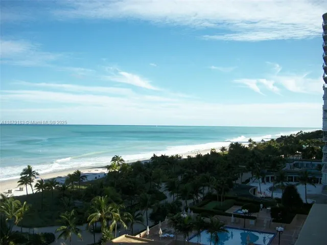 a view of a swimming pool and a chair