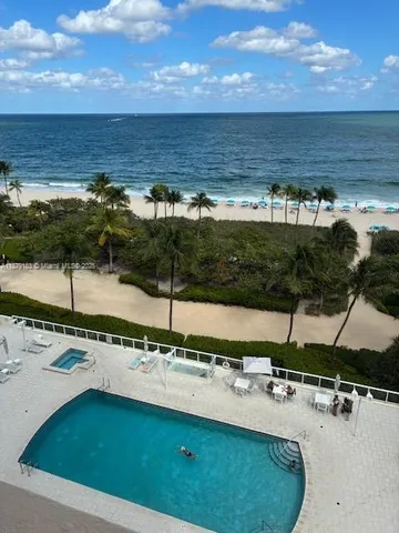 a view of a pool with a yard
