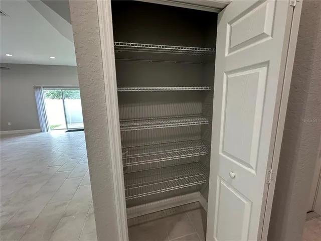 a bathroom with a granite countertop sink and mirror