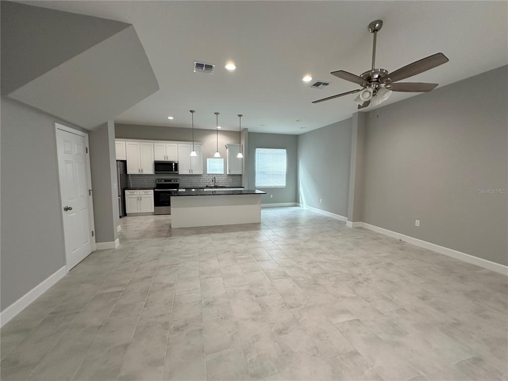 4920 8th Street Zephyrhills, FL 33542 - Photo 22 of 57 a view of a kitchen with a sink and cabinets