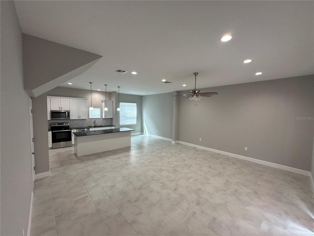 4920 8th Street Zephyrhills, FL 33542 - Photo 23 of 57 a view of kitchen with refrigerator sink and stove