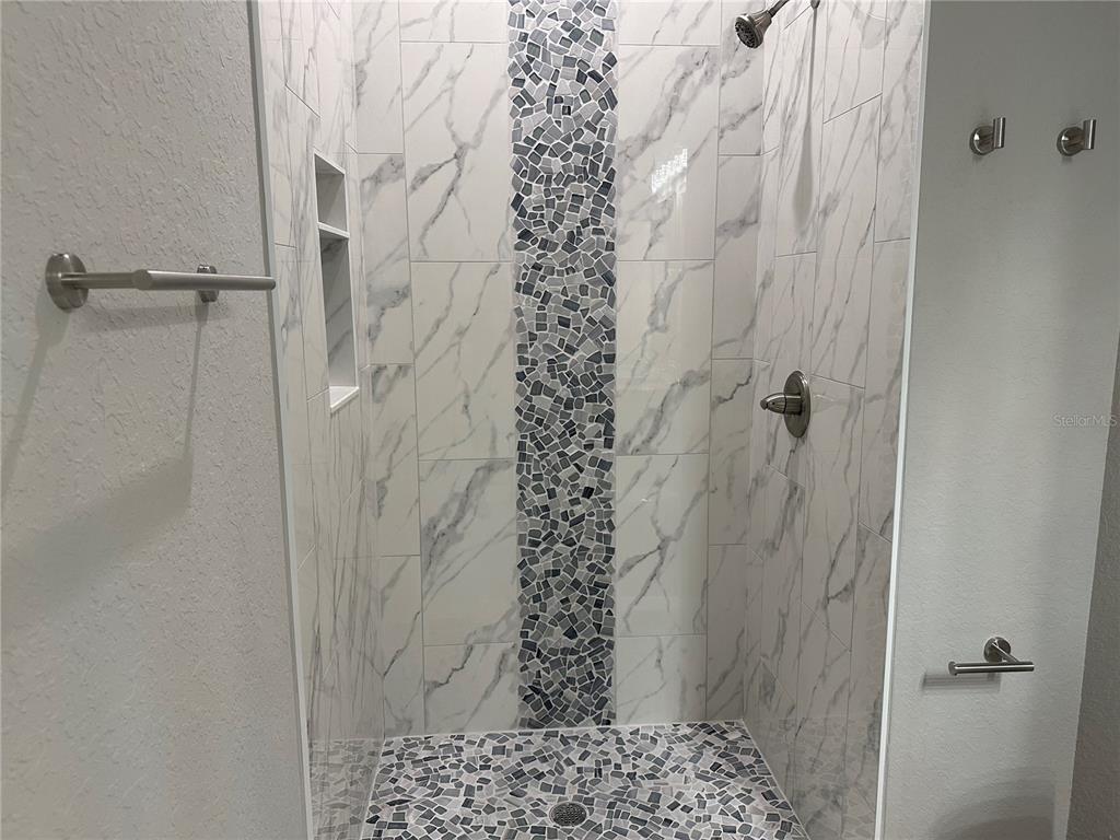 4920 8th Street Zephyrhills, FL 33542 - Photo 49 of 57 a bathroom with a shower