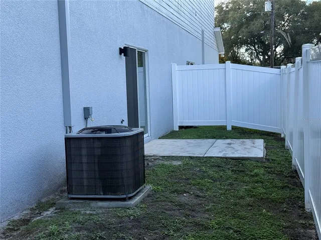 a view of a closet area with hardwood floor