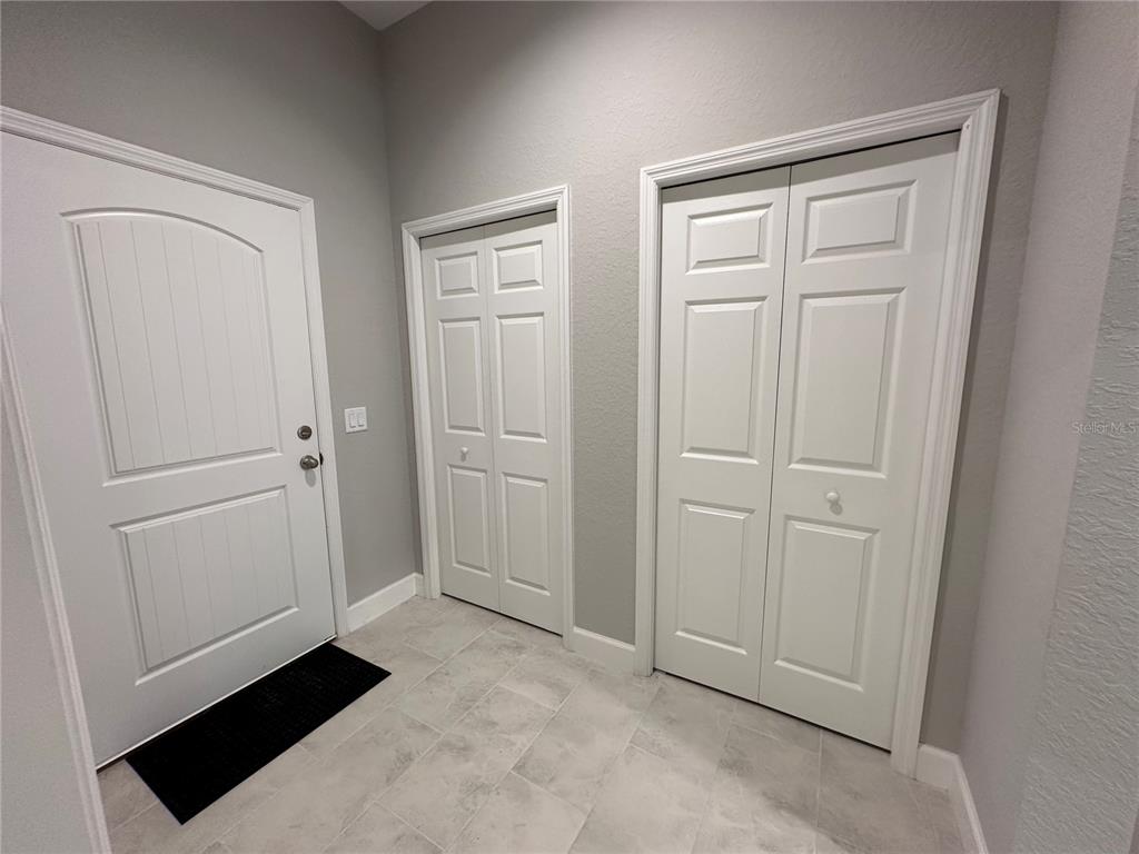 4920 8th Street Zephyrhills, FL 33542 - Photo 8 of 57 a view of a closet area with hardwood floor