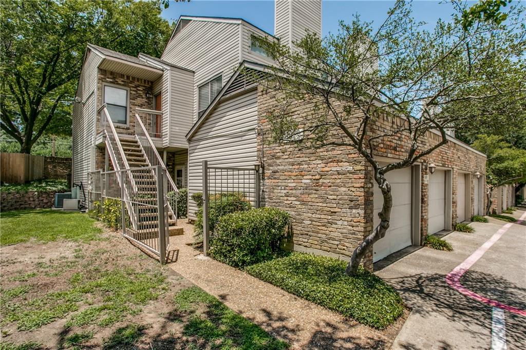 7340 Skillman Street, Unit 102 Dallas, TX 75231 - Photo 1 of 1 a front view of a house with garden