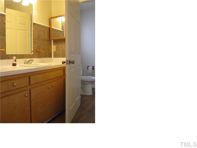 126 Bledsoe Avenue Raleigh, NC 27601 - Photo 7 of 12 a bathroom with a sink and a mirror