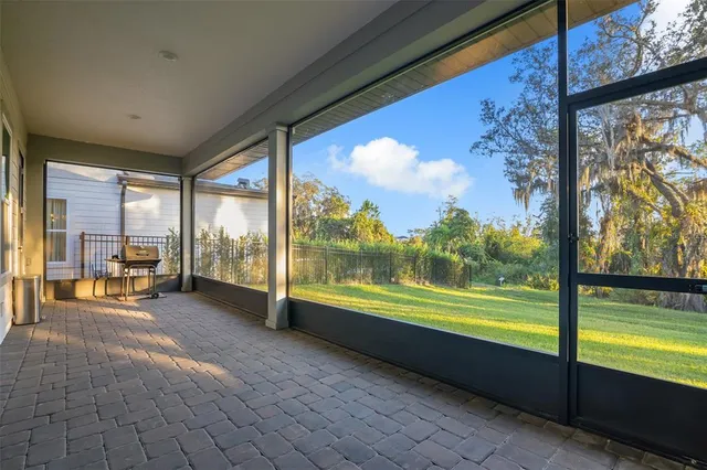 a view of an empty room with a large window