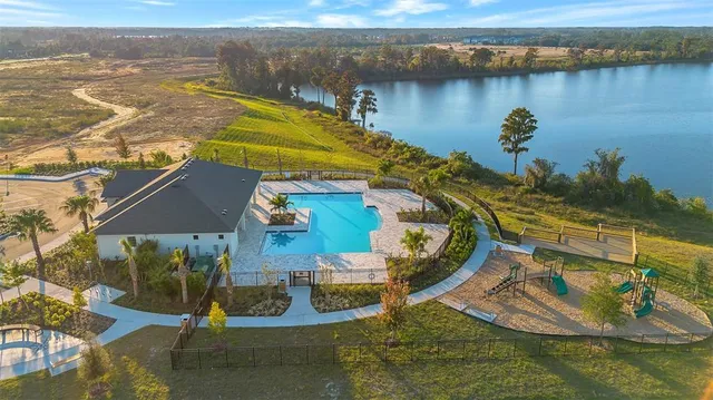 an aerial view of a house with a ocean view