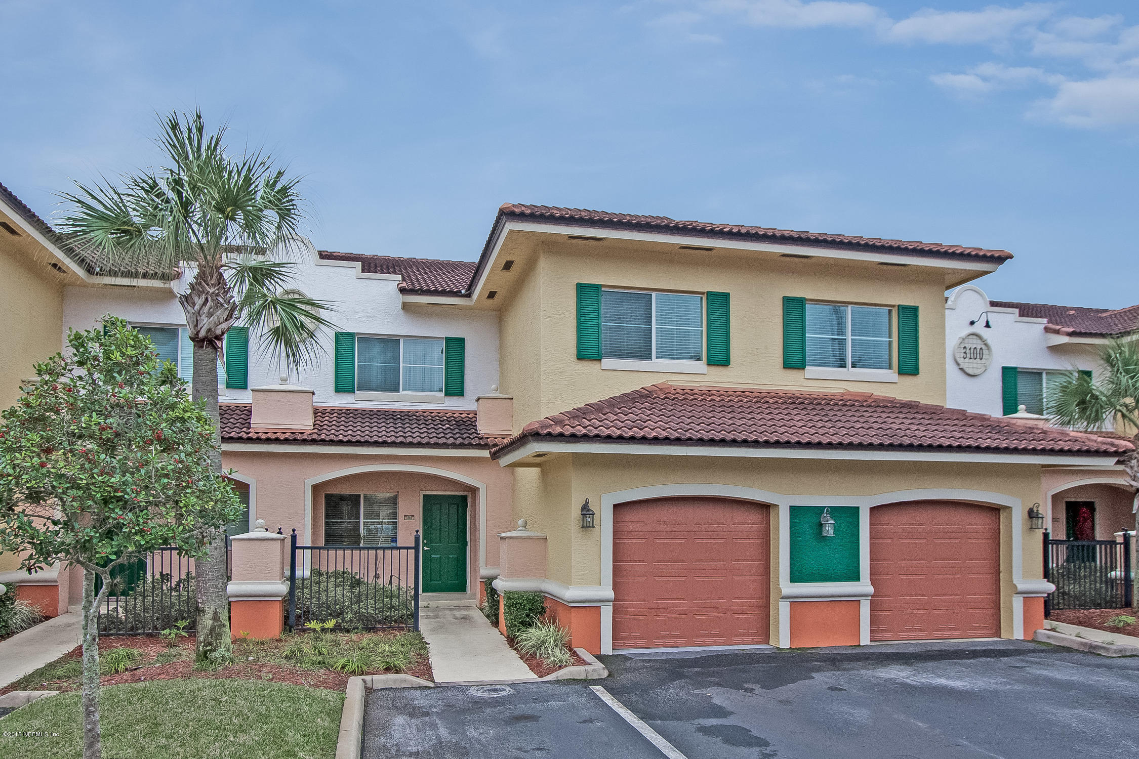 9745 Touchton Road, Unit 3103 Jacksonville, FL 32246 - Photo 1 of 20 a front view of a house with a yard and garage