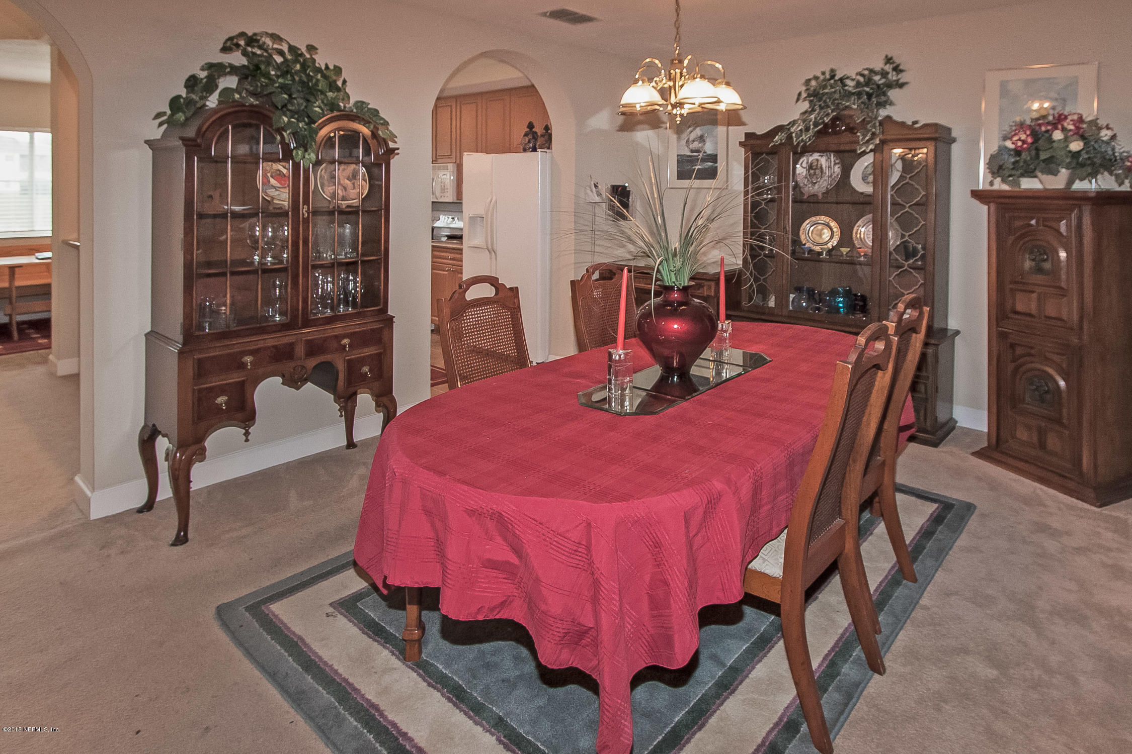 9745 Touchton Road, Unit 3103 Jacksonville, FL 32246 - Photo 12 of 20 a dining room with furniture and chandelier