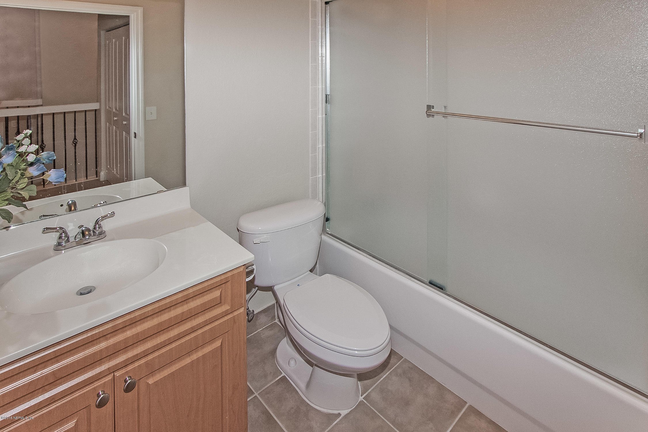 9745 Touchton Road, Unit 3103 Jacksonville, FL 32246 - Photo 8 of 20 a white toilet sitting next to a bathroom sink