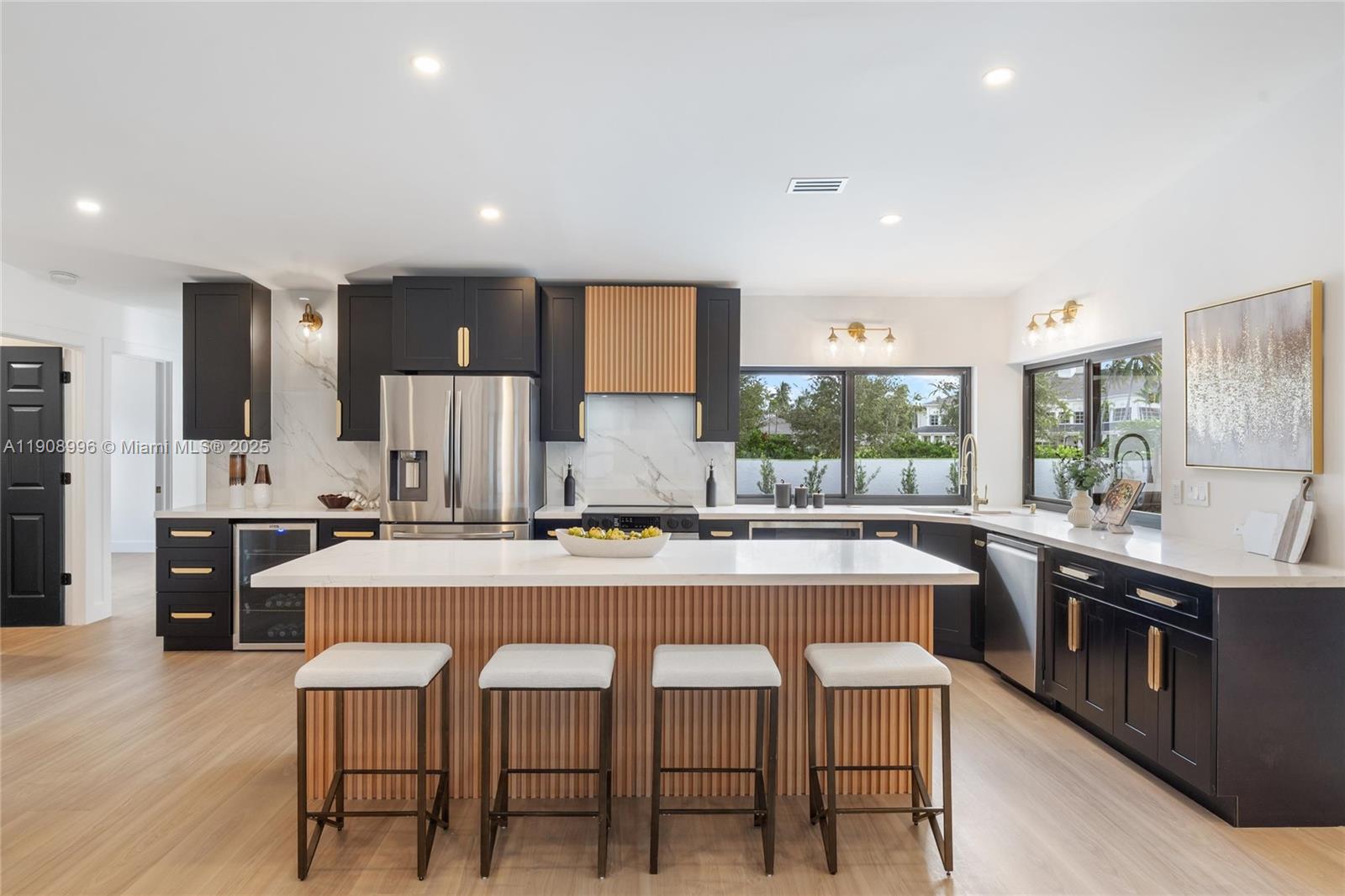 a large kitchen with a table and chairs