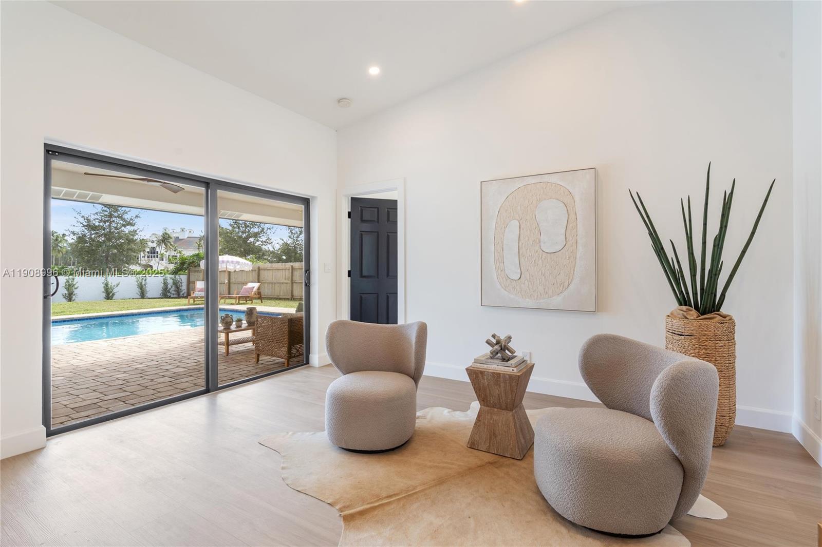 4108 Cedar Creek Road Boca Raton, FL 33487 - Photo 11 of 36 a living room with furniture and a floor to ceiling window